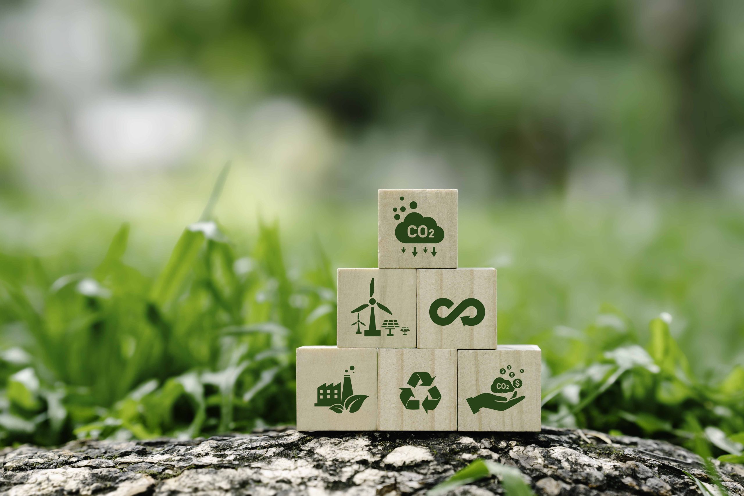 icon reduction of carbon emissions, carbon neutral, Net zero greenhouse gas emissions target, reducing carbon footprint concept, and CO2 emissions target on wooden cubes. circular economy concept
